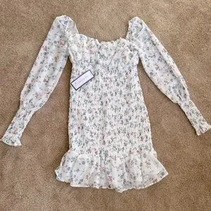 white crochet lace mini dress White Crochet Lace Mini Dress with Puff Sleeves & Ruffles main image 0